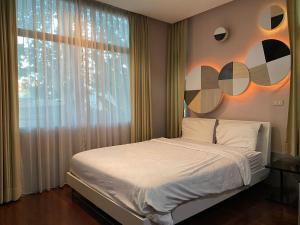 Postelja oz. postelje v sobi nastanitve Huang Su Villa 5 皇宿5号泳池别墅