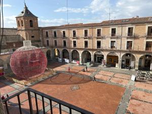a courtyard with a large sphere in front of a building at Mercado Chico SUITES in Avila