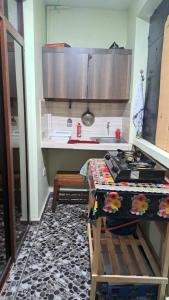 a kitchen with a table and a counter top at Mtwapa june apartment 2 in Mtwapa