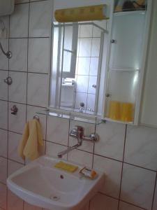 a bathroom with a sink and a mirror at Zimmer in Luka mit Meerblick, Balkon, Klimaanlage, W-LAN 4659-3 in Luka