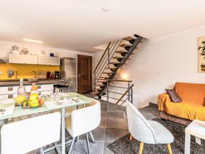 a kitchen and a living room with a table and chairs at Holiday Home Casa Santa Reparata by Interhome in Santa-Reparata-di-Moriani
