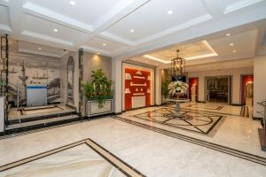 a lobby with a large room with plants on the walls at Byzantium Comfort Hotel in Istanbul