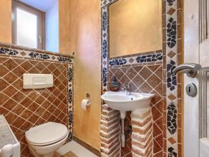 a bathroom with a toilet and a sink at Holiday Home Vista 2 by Interhome in Vrsar