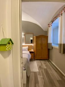 a bedroom with a bed and a window at B&B Corte Santa Maria in Rovereto