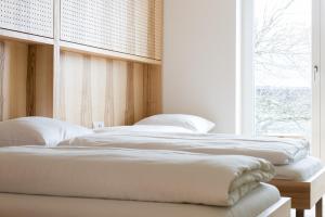 Letto o letti in una camera di Bildungshaus Arbogast