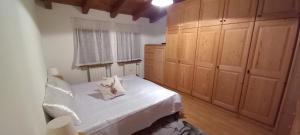 En eller flere senge i et værelse på Mansarda nelle Dolomiti