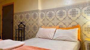 Voodi või voodid majutusasutuse Dar Relax Hostel, Gorges de Todra toas