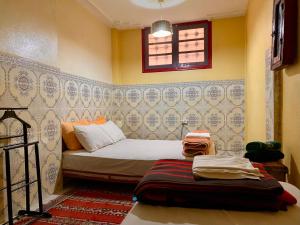 Voodi või voodid majutusasutuse Dar Relax Hostel, Gorges de Todra toas