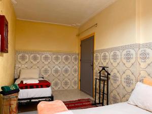 Voodi või voodid majutusasutuse Dar Relax Hostel, Gorges de Todra toas