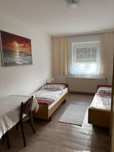 Postel nebo postele na pokoji v ubytování Pension Eicher