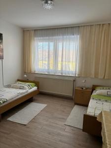 Postel nebo postele na pokoji v ubytování Pension Eicher + 7 fotografií