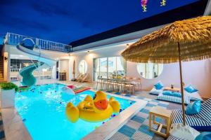 a pool with a inflatable rubber duck in the middle at Cloud9 Pool Villa in Cha Am