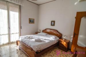 Posteľ alebo postele v izbe v ubytovaní Incantevole Residenza Retro