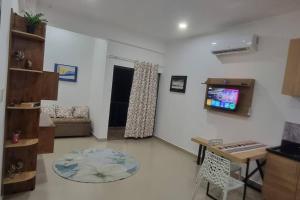 a living room with a couch and a table at Mono ambiente costanera in Encarnación +1 photo