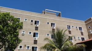 a large building with windows on the side of it at Hotel Solar De Itaborai in Itaboraí