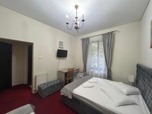 Postel nebo postele na pokoji v ubytování Hotel Stavilar
