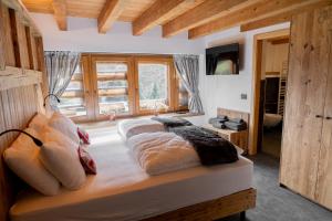 Letto o letti in una camera di Chalet Al Maso Val Calamento
