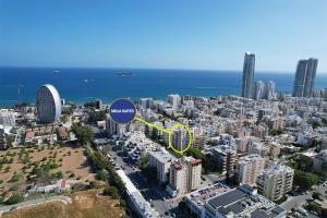 an aerial view of a city with a blue circle at Melia Suites in Limassol
