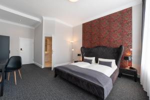 Postel nebo postele na pokoji v ubytování Hotel Commodore