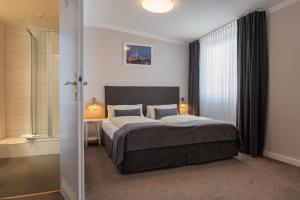 Postel nebo postele na pokoji v ubytování Hotel Commodore