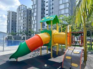 a playground with a slide in a city at Cozy 4B2B for 8 pax - 15 min to Lotus's Mall Kajang in Kampong Paya
