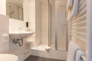 Koupelna v ubytování Hotel Commodore