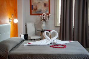 Postel nebo postele na pokoji v ubytování Mg Palace Hotel Costa del Sole