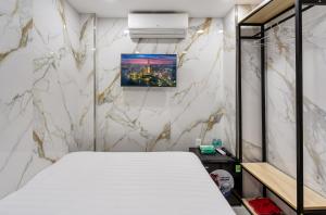 Postel nebo postele na pokoji v ubytování Hoàng Quỳnh Hotel