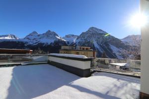 a view of a snow covered mountain from a balcony at Galerie 5A by Arosa Holiday in Arosa