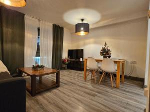 a living room with a table and chairs and a dining room at Dublin Exchange Suites in Dublin