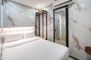 Postel nebo postele na pokoji v ubytování Hoàng Quỳnh Hotel