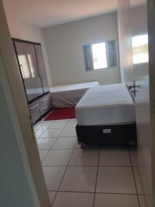 Ένα ή περισσότερα κρεβάτια σε δωμάτιο στο Hostel França - Quarto 3