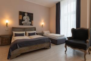Postel nebo postele na pokoji v ubytování Hotel Commodore