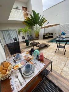 a table with food on it in a living room at Pousada Hotel Boutique Ventanas in Carolina