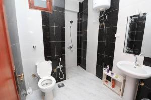 a bathroom with a toilet and a sink at Moka Gust House in Luxor +59 photos