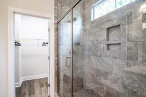 a bathroom with a shower with a glass door at Island Escape Relax and Unwind in Pawleys Island in Pawleys Island +21 photos