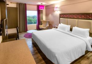 Postel nebo postele na pokoji v ubytování Hotel Visakka Palani