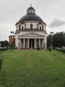 a building with a dome on top of a grass field at Széchenyi Apartman Széchenyi tér 13 in Esztergom +53 photos