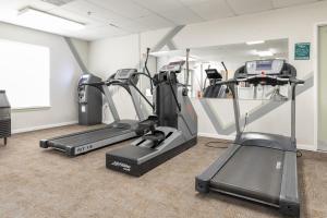 a gym with two tread machines and a treadmill at Carriage Place in Branson