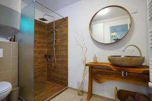 a bathroom with a sink and a mirror at Noszvaj Chillout Afrika in Noszvaj +6 photos