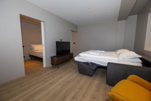 Postel nebo postele na pokoji v ubytování Storigardur Premium Apartments