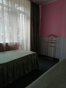 Postel nebo postele na pokoji v ubytování ГОТЕЛЬ Заводу 410 ЦА