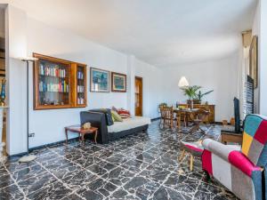 a living room with a couch and a table at Apartment Artista by Interhome in Cecina +50 photos