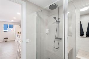 a shower with a glass door in a bathroom at Vivienda Vacacional Magma in Santa Brígida +18 photos