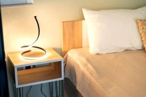 Postel nebo postele na pokoji v ubytování Avant Apartment
