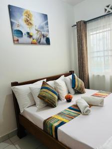 Postel nebo postele na pokoji v ubytování Uniplex Homes 2 Bedroom