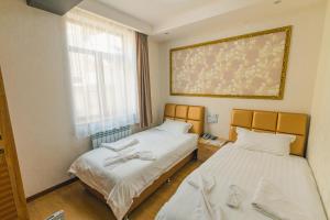 Postel nebo postele na pokoji v ubytování Hotel Garden House
