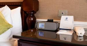 a clock on a table in a hotel room at Best Western Royal Hotel in Saint Helier Jersey +70 photos