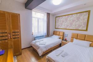 Postel nebo postele na pokoji v ubytování Hotel Garden House