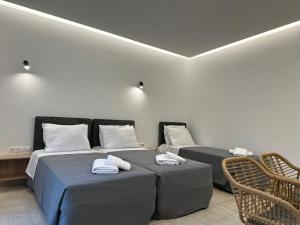 Postel nebo postele na pokoji v ubytování Olympian Altis Hotel